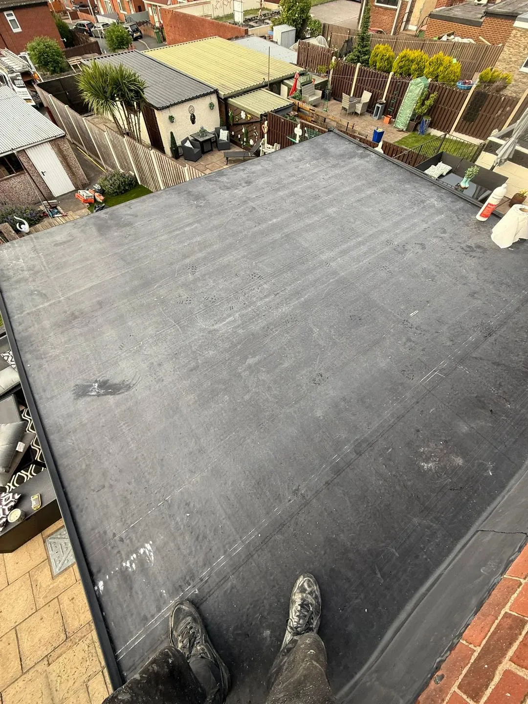 A person standing on top of a flat roof.