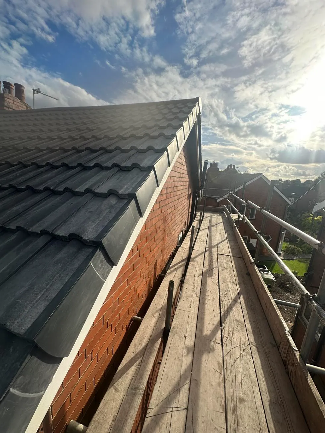 the roof of a building with a sky background